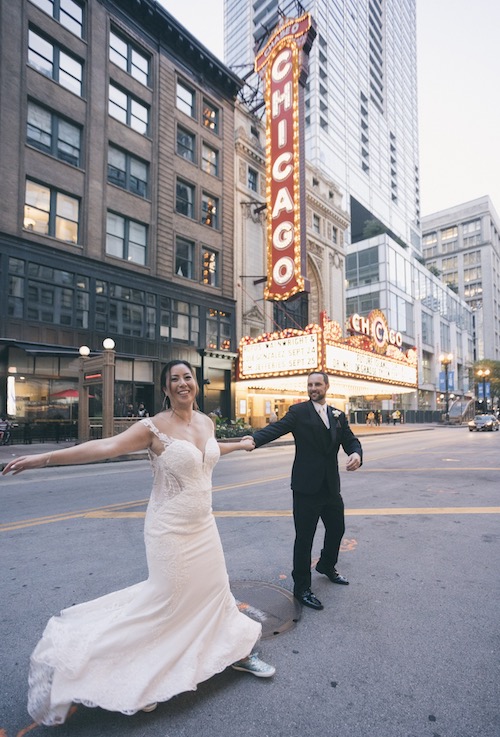 Brandon and Tiffany wedding dance in the street in front of the Chicago theater