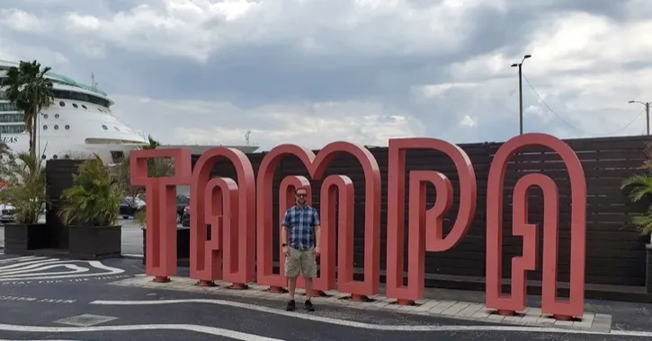 Brandon in front of Tampa sign